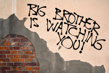 Handwritten graffiti Big Brother Is Wtching You sprayed on the wall, anarchist aesthetics