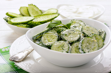 Fresh cucumber salad with yogurt and herbs.