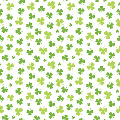 Seamless Irish background pattern for St Patrick's Day with shamrocks in green and white. St Patrick's Day, giftwrap, wallpaper, textiles.