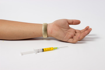 syringe of drug and dead arm