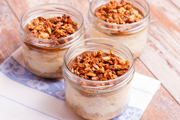 dessert with cream, granola and jam, closeup, horizontal