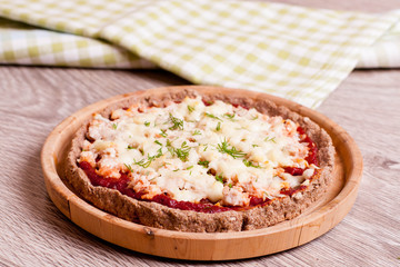 Colorful pizza with cheese, chicken and dill close up horizontal