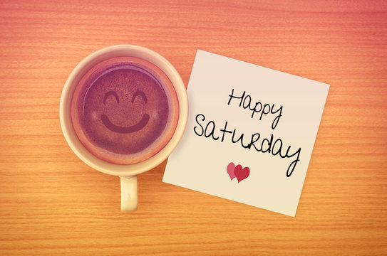 Fototapeta Happy Saturday on paper note with coffee cup,top view.