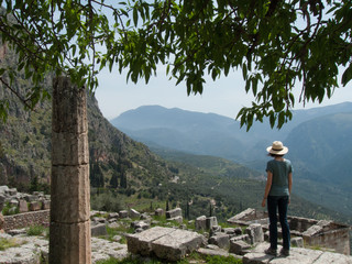 Fototapeta na wymiar Young woman visiting Delphi, Greece, Europe