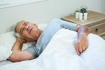 High angle view of senior man sleeping