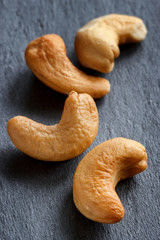 Roasted cashew nuts on dark background