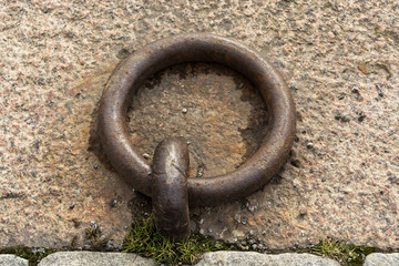 Obraz premium Wrought iron ring for mooring the yacht at pier