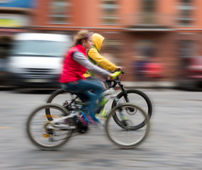 Children riding bicycles on a city street