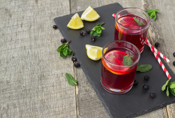 berry lemonade, refreshing summer beverage on a dark background