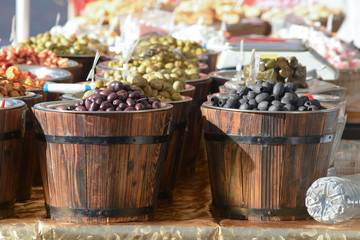 Barrels of olives for sale at market stall