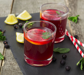 berry lemonade, refreshing summer beverage on a dark background