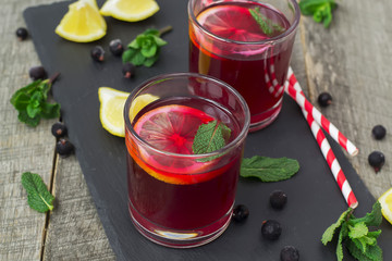 berry lemonade, refreshing summer beverage on a dark background