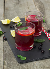 berry lemonade, refreshing summer beverage on a dark background