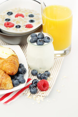 Breakfast with Yogurt, Orange Juice, Berries and Croissant