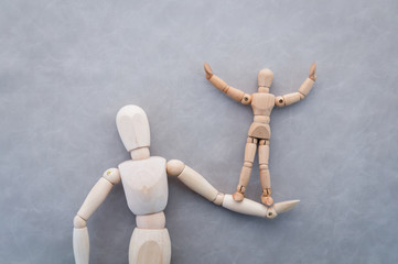 wooden figure toys business support concept.jpg