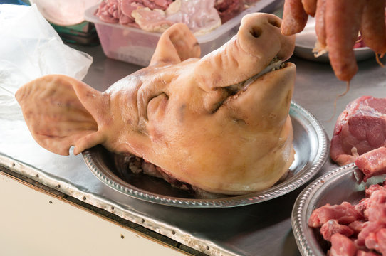 Pig's head chopped off in fresh market