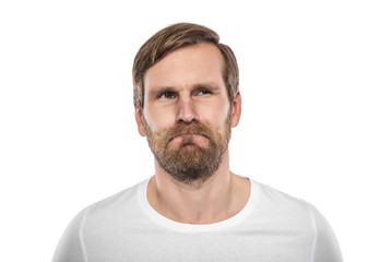 Obraz premium Young man in a white shirt is thinking intensely.