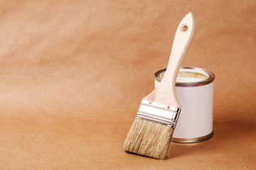Paint can with brush