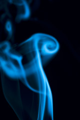 Blue smoke on black background