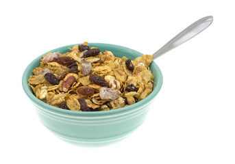 Side view of a bowl of breakfast cereal with spoon