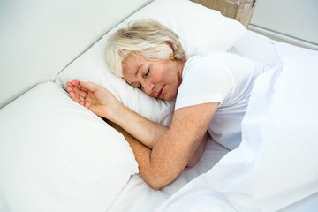 High angle view of old woman sleeping