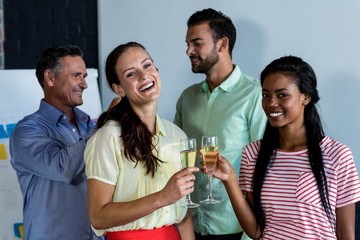 Colleagues toasting champagne flutes