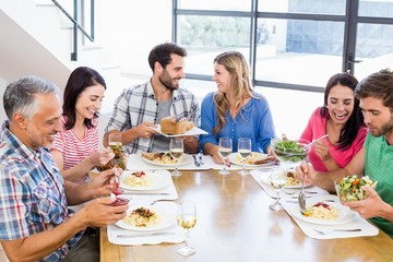 Friends interacting while having a meal