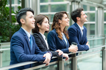 Business people look far away at outdoor
