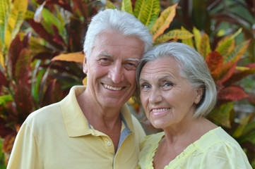 Elderly couple  in tropical garden