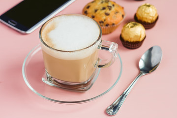 Coffee with dessert on a pink table