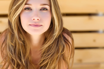 portrait of a beautiful woman wooden background  - Powered by Adobe