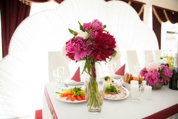 stylish luxury cute  small   bouquet of  colored peonies