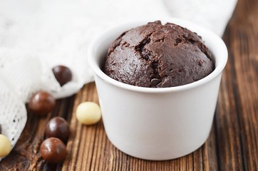 Chocolate muffin on a wooden table