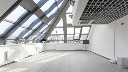 Interior with a glass ceiling and white walls.