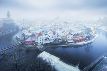 Panoramic aerial view over the old Town of Cesky Krumlov at the time of snowfall, Czech Republic.