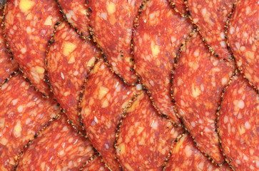Black pepper-coated salami with cheese