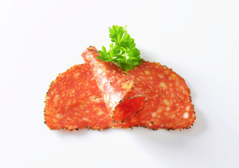 Black pepper-coated salami with cheese