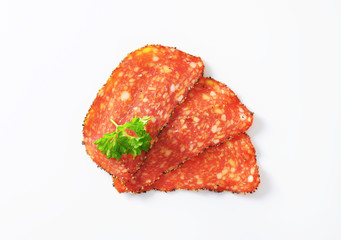 Black pepper-coated salami with cheese