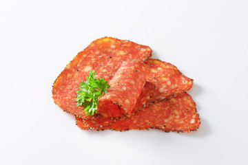 Black pepper-coated salami with cheese