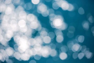 Bokeh light ,defocused of sea wave surface and color toned.