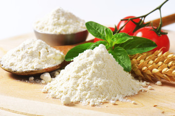 Wheat flour on wooden board