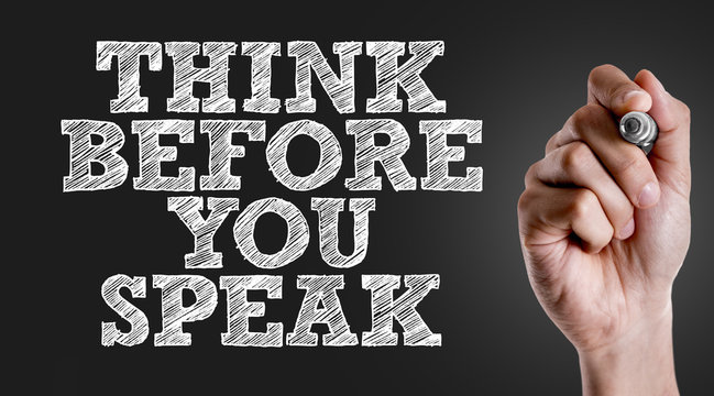 Hand writing the text: Think Before You Speak