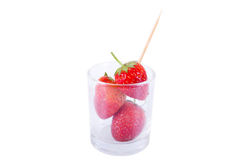 Fresh ripe strawberries in glass with toothpick isolated on whit