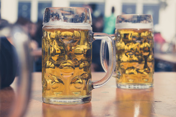 beer glasses in german beer garden background