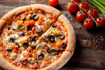 Pizza with tomato, mushroom and olives