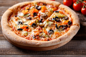 Pizza with tomato, mushroom and olives