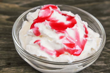 Frozen yogurt with raspberry syrup
