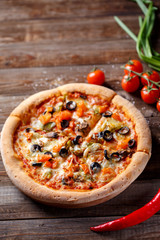 Pizza with tomato, mushroom and olives