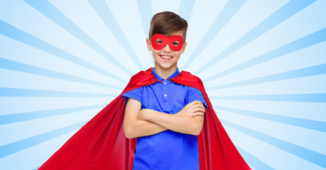 boy in red super hero cape and mask
