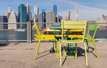 Table and chairs with view on Manhattan